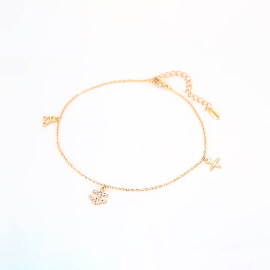 Adventure Awaits Gold Tone Charm Anklet - HARMA